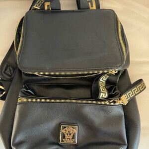 Versace Black and Gold Backpack with Modern Silhouette